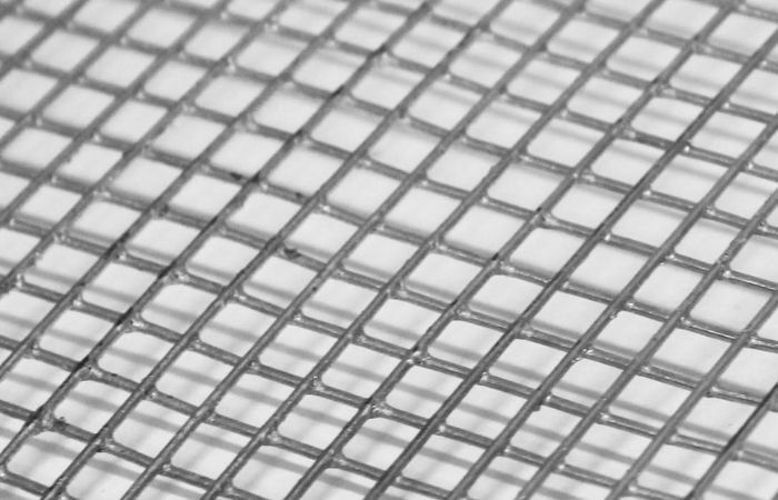 Galvanised woven wire mesh featuring a protective zinc coating, suitable for fencing, enclosures, and industrial applications with moderate corrosion exposure.